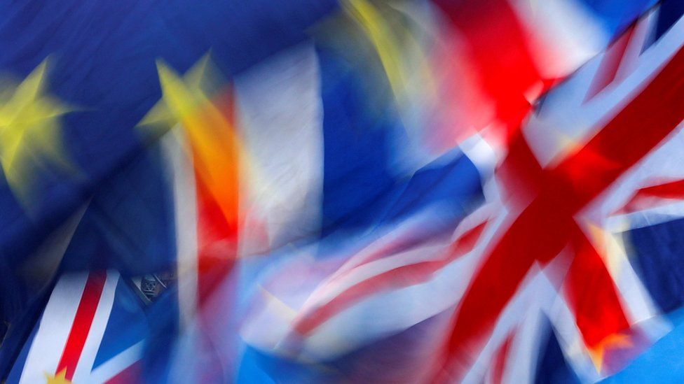 British and EU flags flutter outside the Houses of Parliament