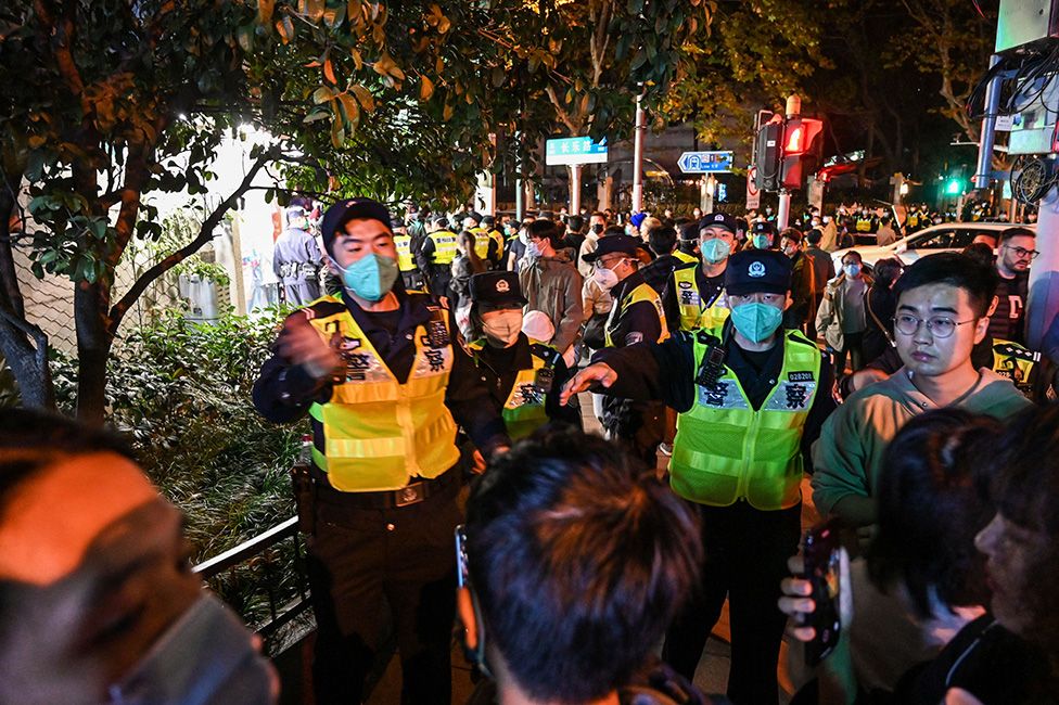 Police try to control crowds in Shanghai