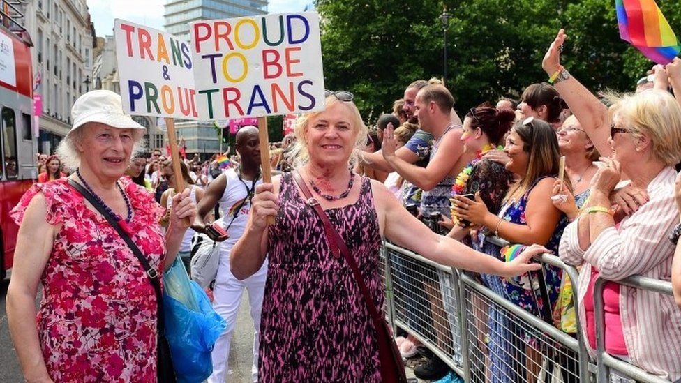 Transgendered pensioner Margaret Pepper (formerly Maurice), 73 (L) holds a placard "trans and Proud" as she takes part in London Pride parade in London, Britain, 08 July 2017.