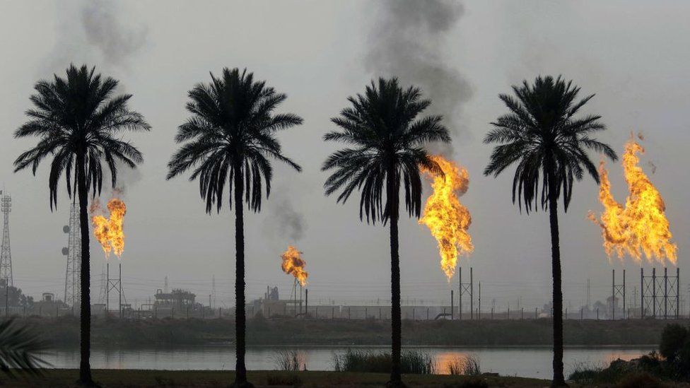 Flames rising from the burning of excess hydrocarbons at the Nahr Bin Omar natural gas field, north of the southern Iraqi port of Basra.