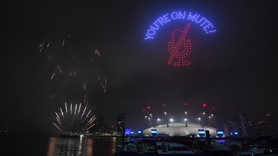 Fireworks and drones illuminate the night sky over London as they form a light display as London"s normal New Year"s Eve fireworks display was cancelled due to the coronavirus pandemic.