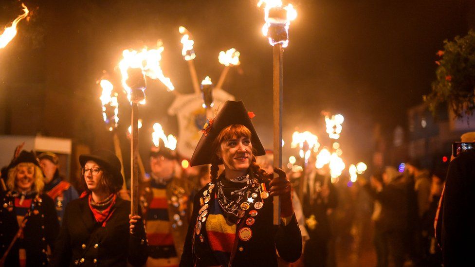 Bonfire societies parade through the streets during traditional Bonfire Night celebrations
