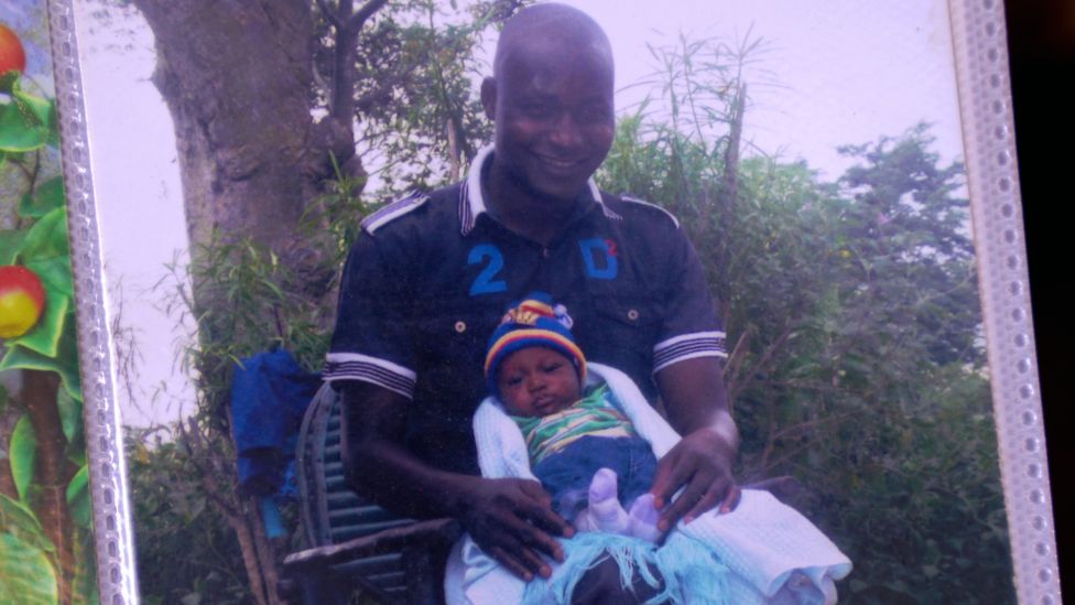 James Masha pictured with one of his children when they were a baby