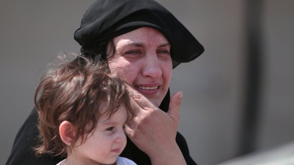 A woman after being evacuated from Manbij.