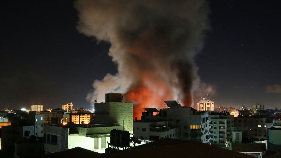 Smoke and fire rise after Israeli army carried out attacks over buildings in Gaza