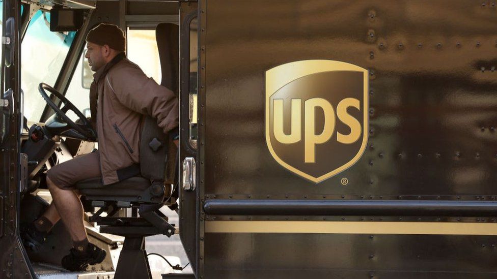 A United Parcel Service (UPS) driver sits in his delivery truck on January 31, 2023 in San Francisco, California.