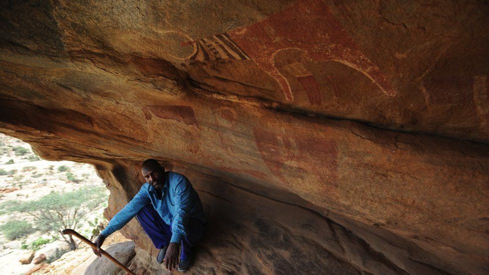 Rock paintings depicting hunters, long-horned cattle and antelope, giraffes and elephants decorate granite caves in Laas Geel, Somalia. Pictured in June 2017