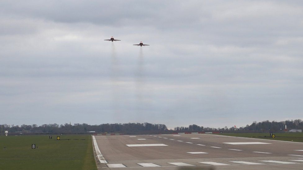 The Red Arrows over the runway