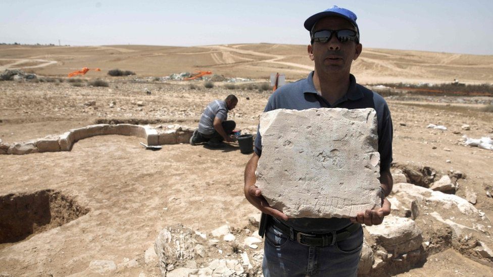 A worker from Israel's Antiquities Authority at the site of an ancient mosque