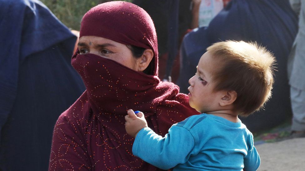A woman holding her child in Kabul, Afghanistan