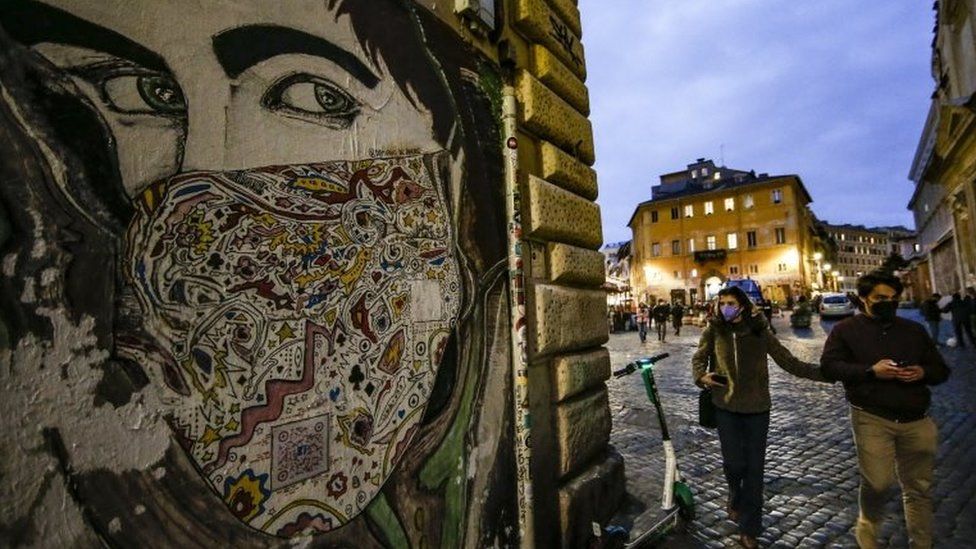 People walk in Rome, Italy. Photo: 12 March 2021