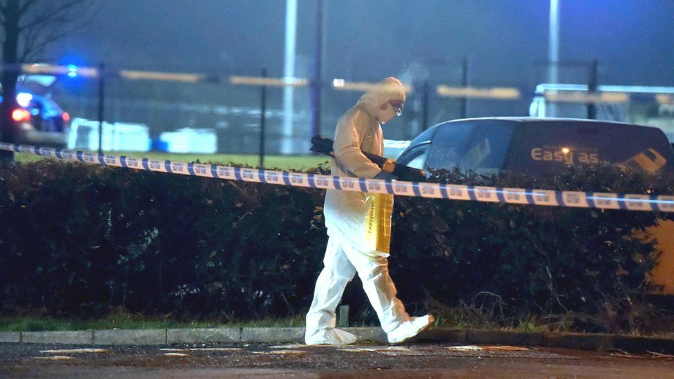 A forensics officer at the scene of a shooting in the Killyclogher Road area of Omagh