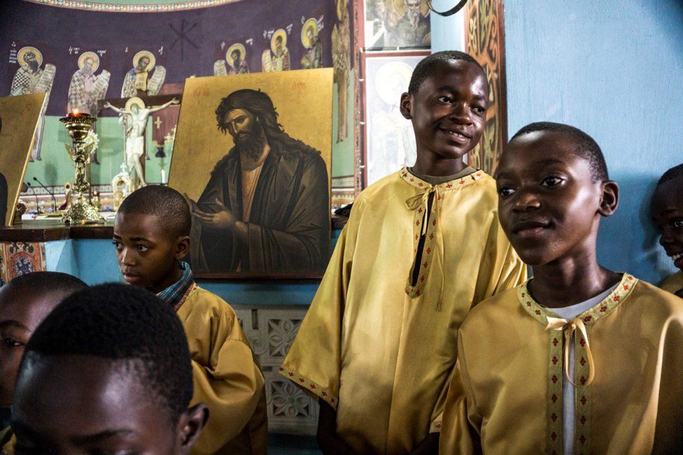 Congolese altar boys of the Greek Orthodox Church attend a Sunday mass at the Saint Andrew Cathedral in Kananga.