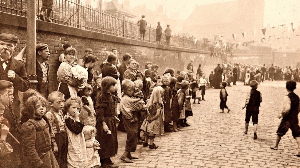 Children outside the Charter Street Mission in the 1800s