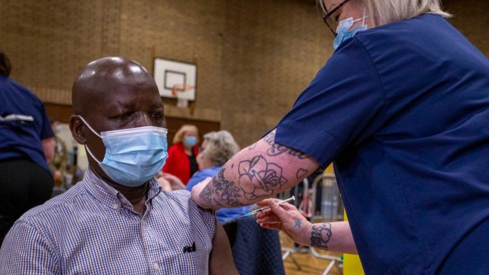 A doctor receives his second dose of vaccine in Newbridge, Caerphilly county