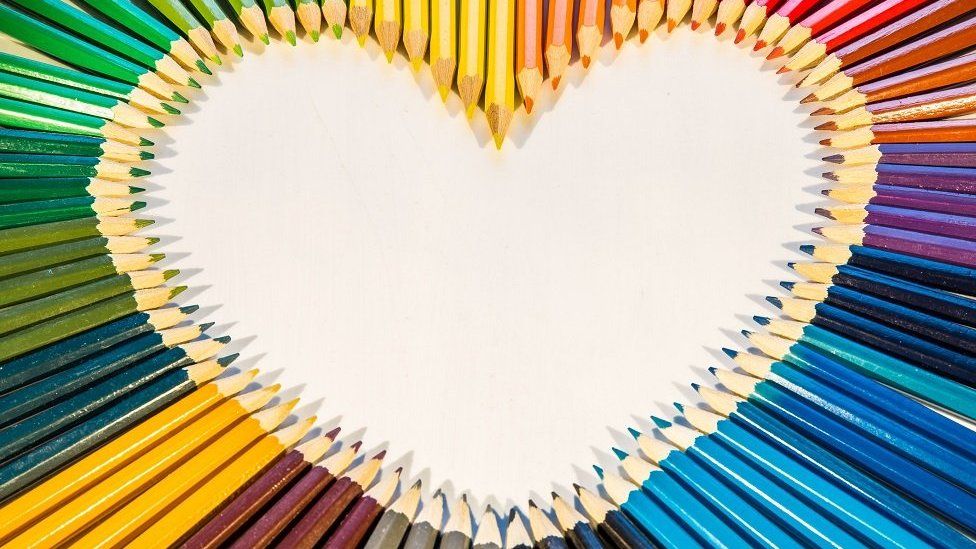 Rainbow heart made of pencils