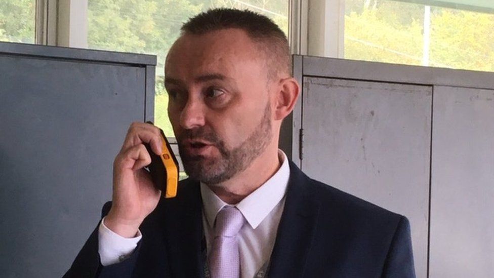 Head teacher Alan Rowlands with a walkie talkie
