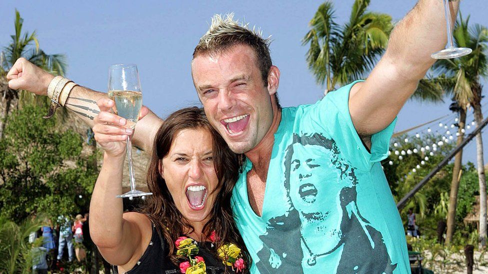 Love Island 2005 winners, Jayne Middlemiss and Fran Cosgrave, both holding glasses of wine