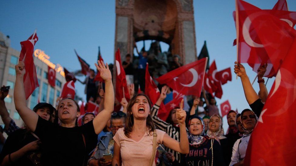 People chant slogans as they gather at a pro-government rally in central Istanbul"s Taksim square, Saturday, July 16, 2016.