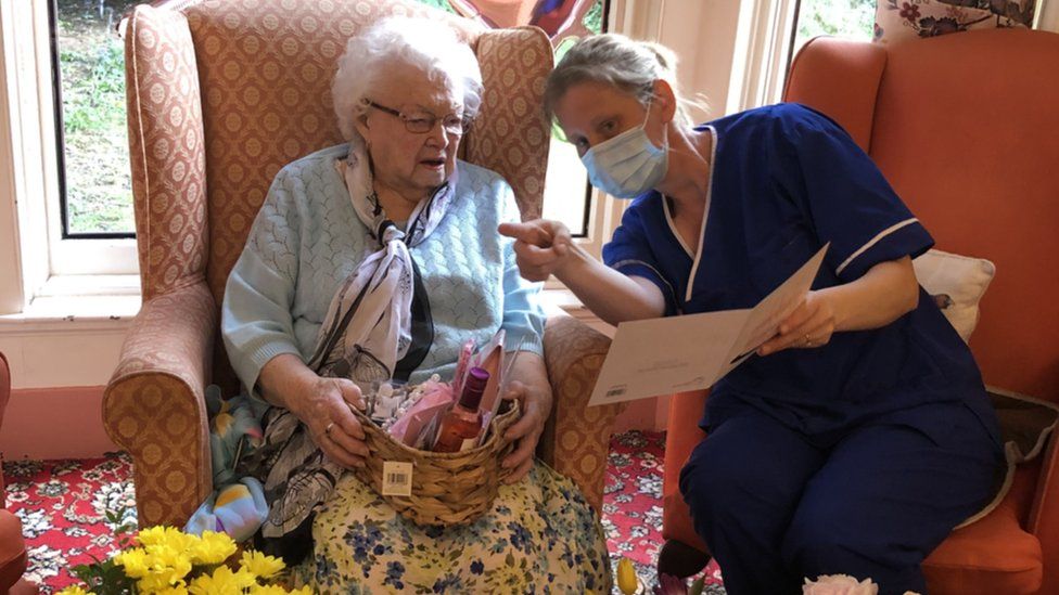 A care home resident with a worker