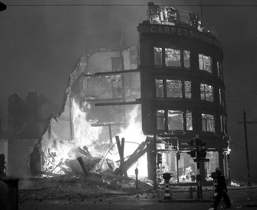 Burning building in Manchester after a German air raid, December 1940