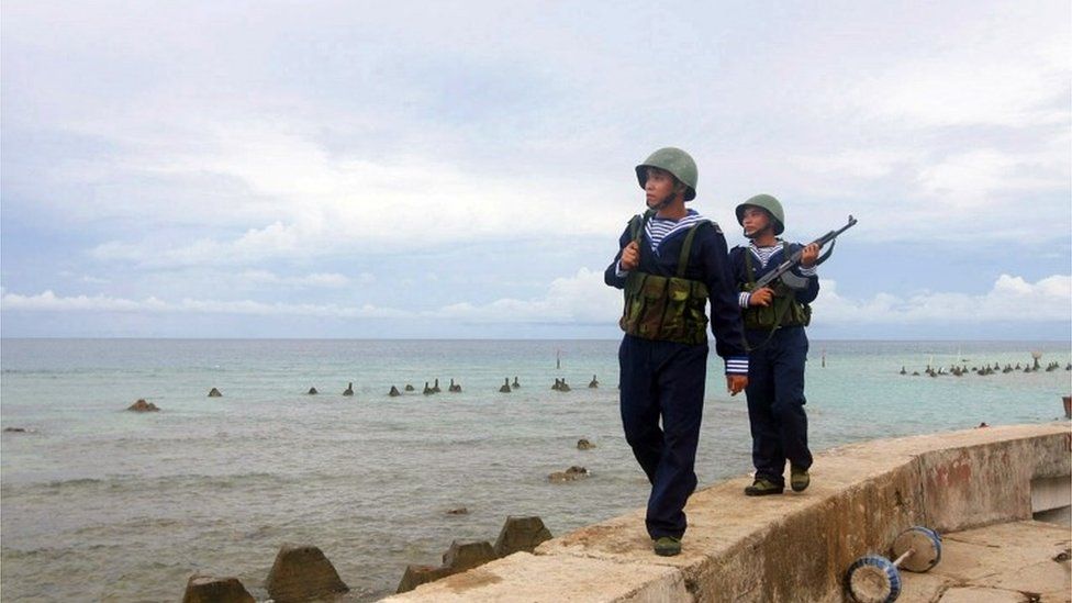 This picture taken by Vietnam News Agency and released on June 14, 2011 shows Vietnamese sailors patrolling on Phan Vinh Island in the Spratly archipelago