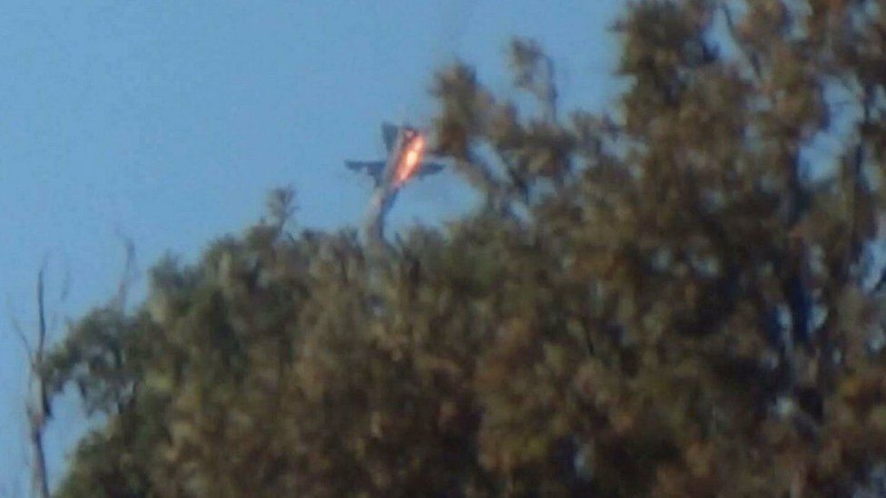 A Russian warplane crashes in northern Syria, after reportedly being shot down by Turkish jets (24 November 2015)