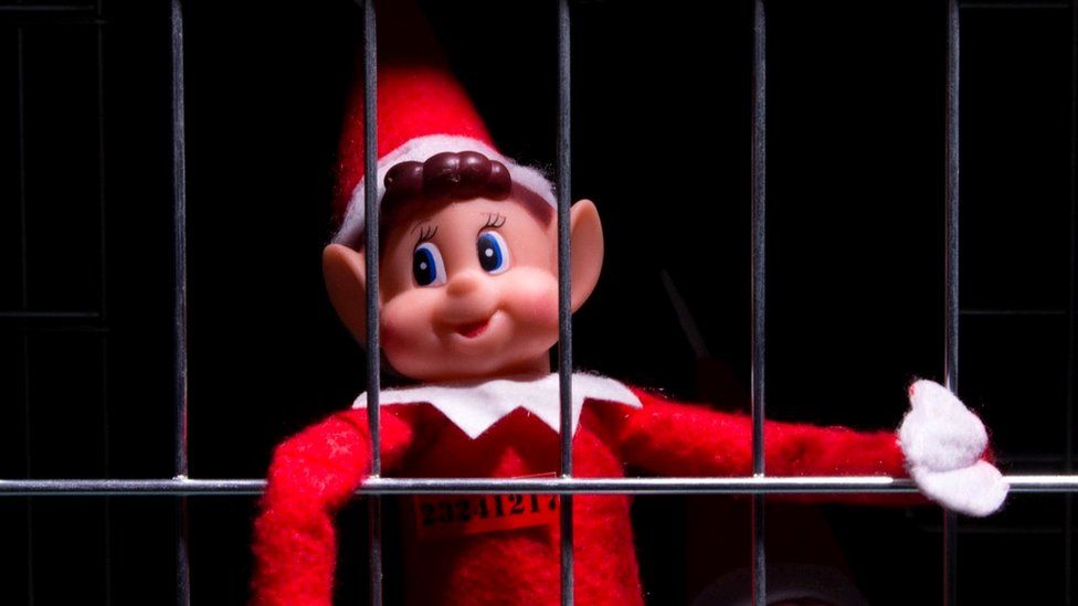 Naughty elf behind bars