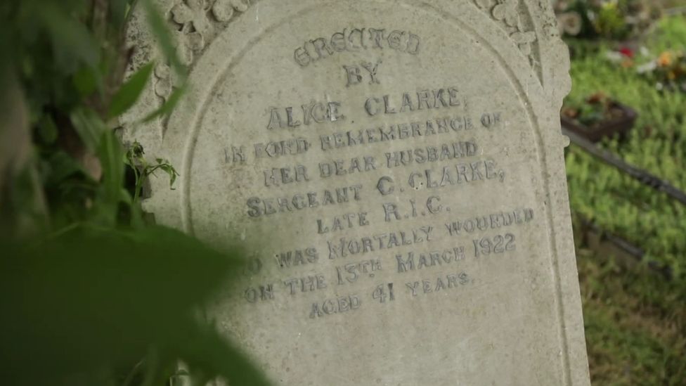The gravestone for Sergeant Clarke, worn down from time, with a dedication from his wife Alice Clarke