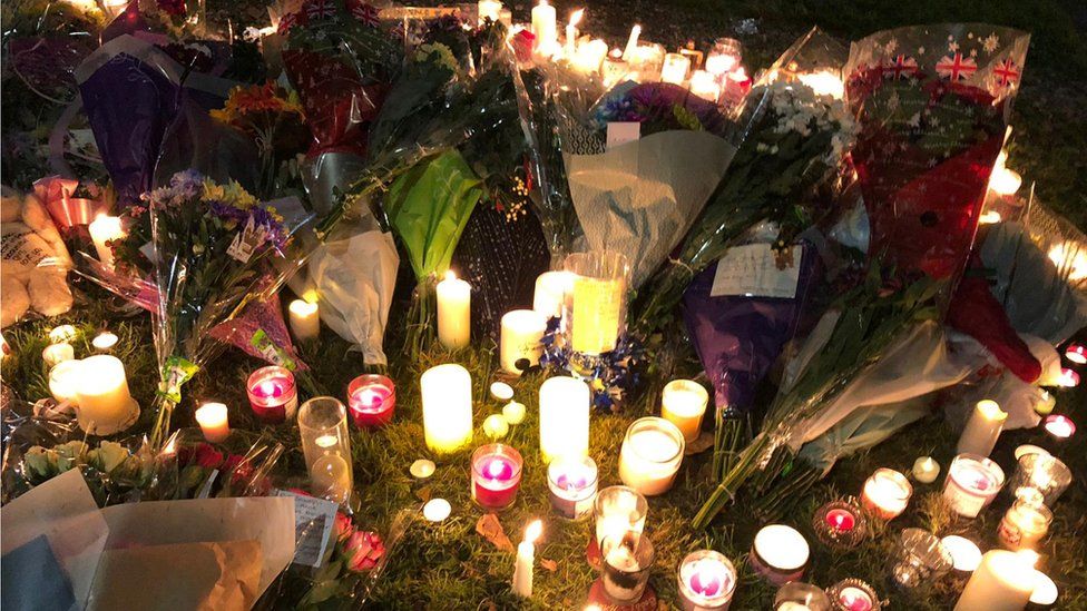 Candles and flower tributes