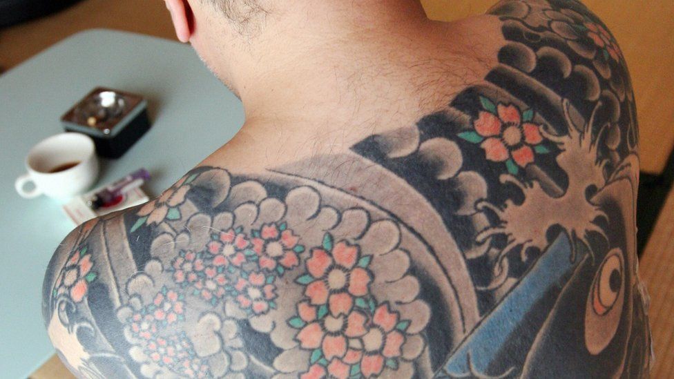 Image shows back tattoo typical of a Yakuza member