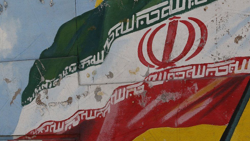 Iranian flag on a mural in Tehran