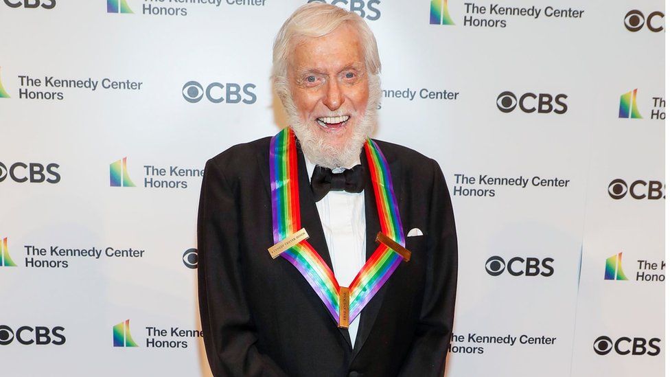 Dick Van Dyke smiles for cameras on the red carpet.