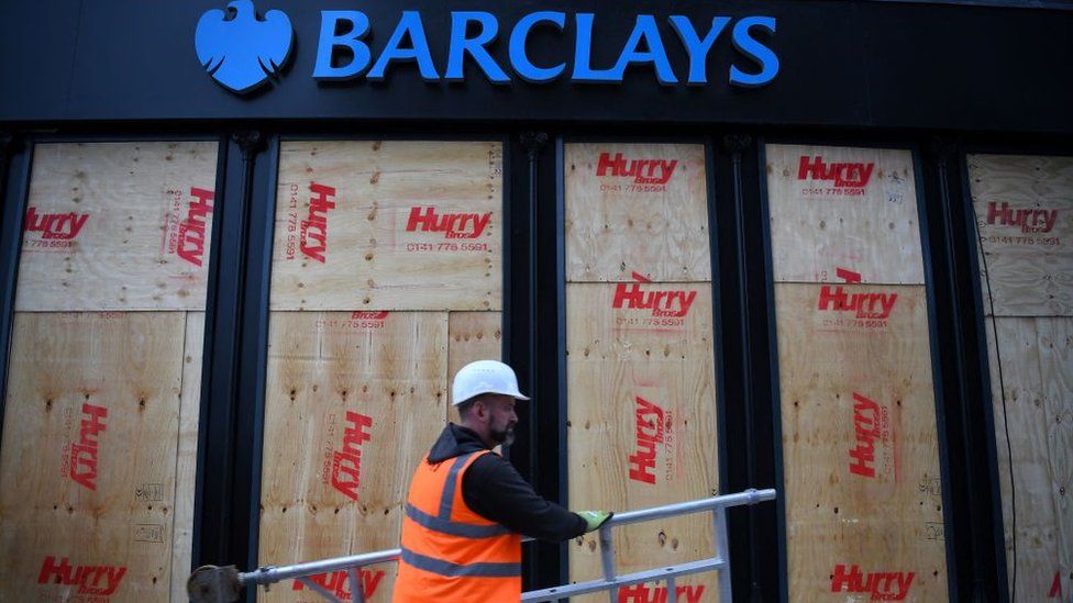 Barclays bank in Glasgow with boarded-up windows after a protest