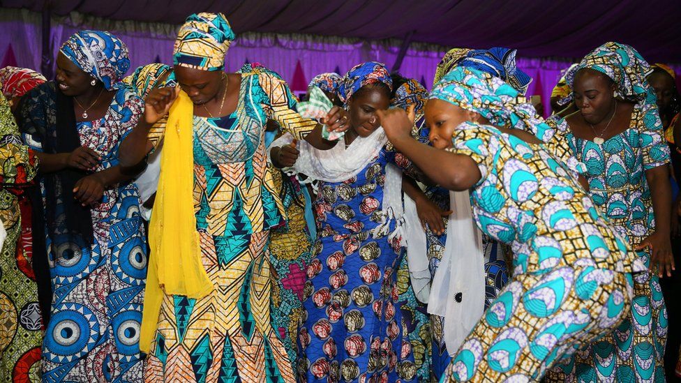 Image shows 'Chibok girls' dancing at a party in Abuja