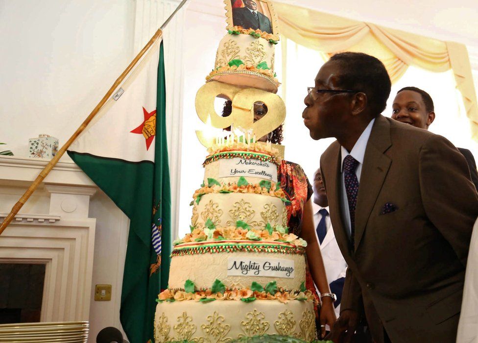 Zimbabwean President Robert Mugabe blowing out cake candles, Harare, Zimbabwe - Monday 22 February 2016