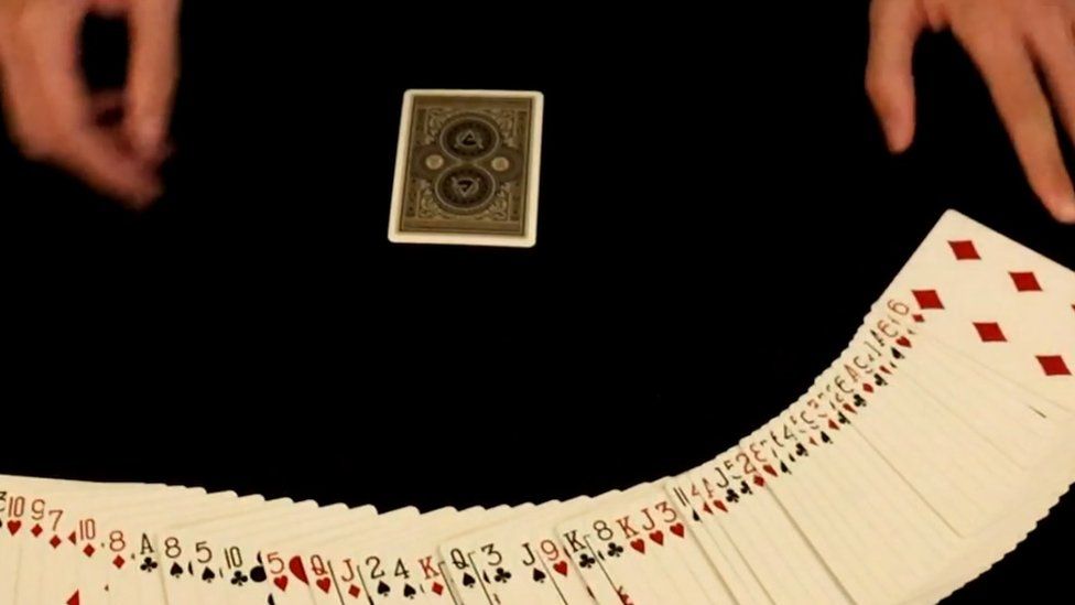 Morgan shuffling a deck of cards