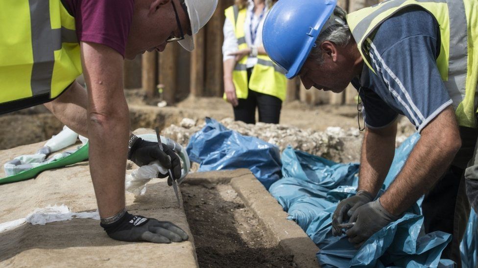 The sarcophagus is unearthed