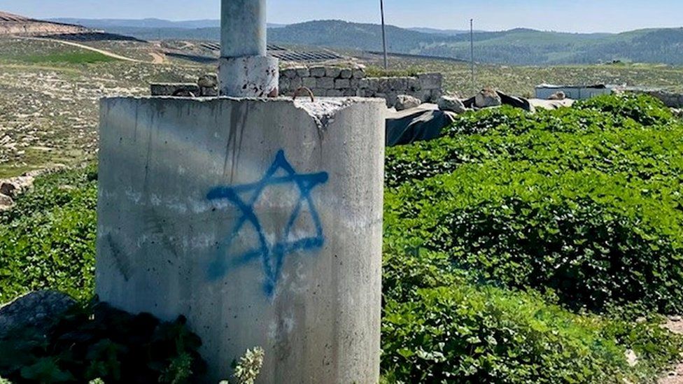 Star of David is seen as graffiti on concrete in the Palestinian village of Zanuta, in the occupied West Bank