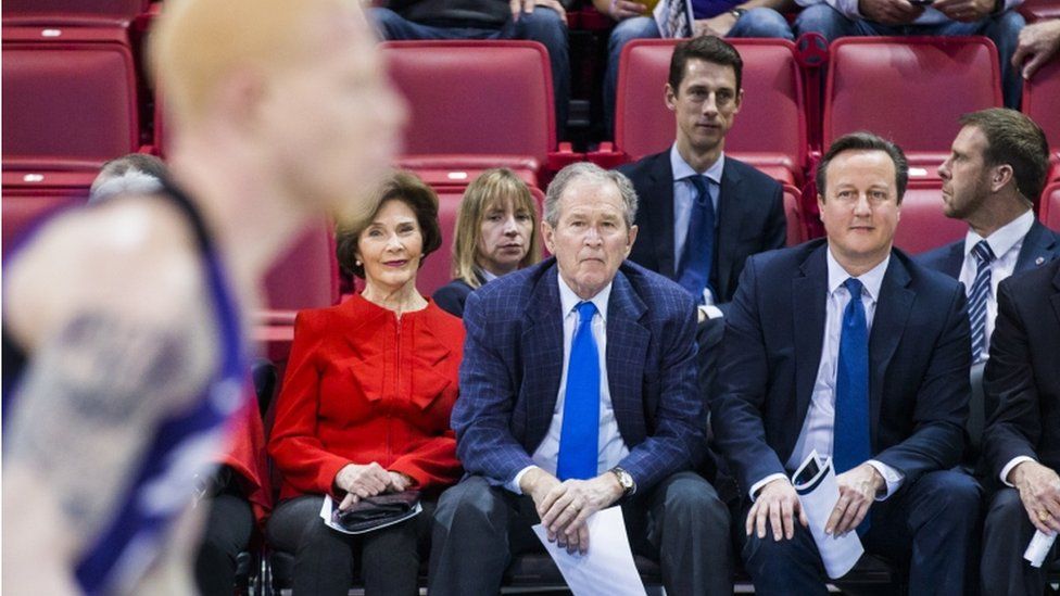 George W Bush and David Cameron at a basketball game
