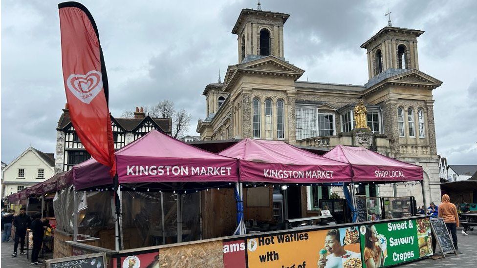Kingston Market stalls with Market House in the background.