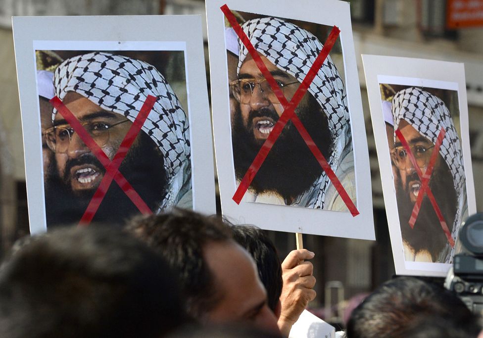 Indian activists carry placards of the chief of Jaish-e-Mohammad, Maulana Masood Azhar during a protest against the attack on the air force base in Pathankot, in Mumbai on January 4, 2016