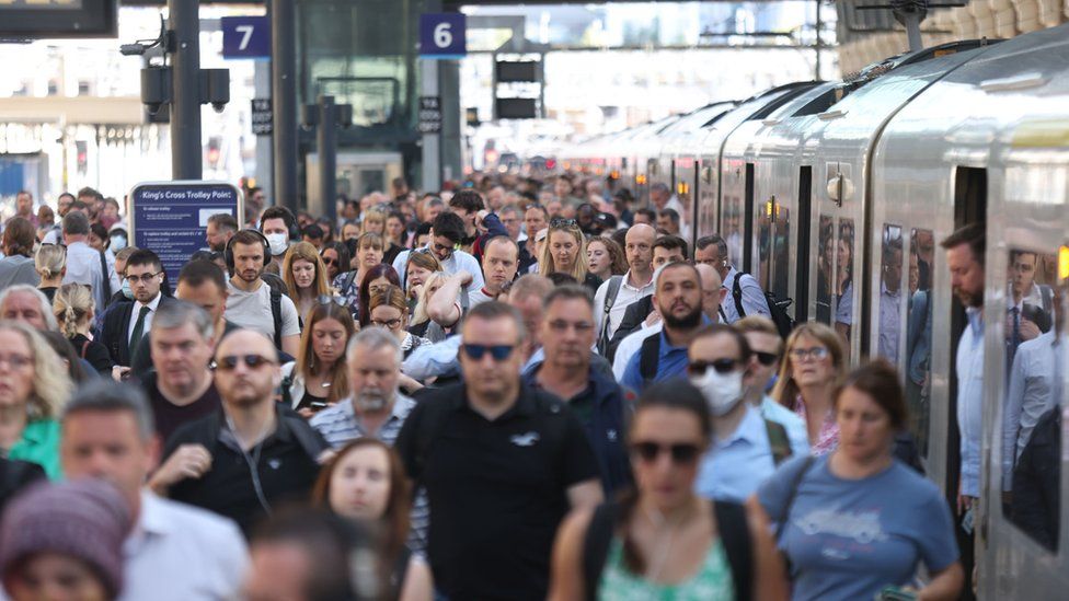 Crowds of passengers at Kings Cross Station