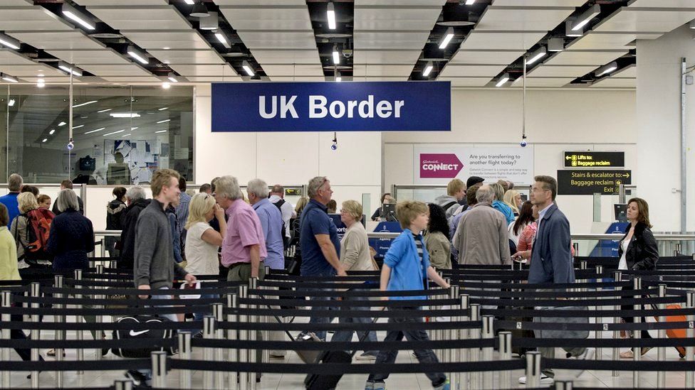 Passport checks at the UK border in Gatwick Airport
