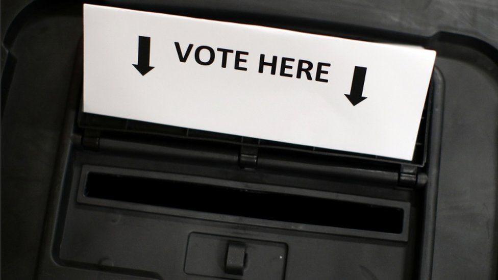 A ballot box is photographed inside a polling station on general