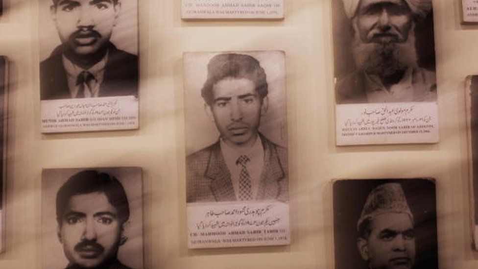 Photographs of members of the Ahmadi community who have been killed in different attacks hang on a wall in the Ahmadi museum in Chenab Nagar (July 2010)