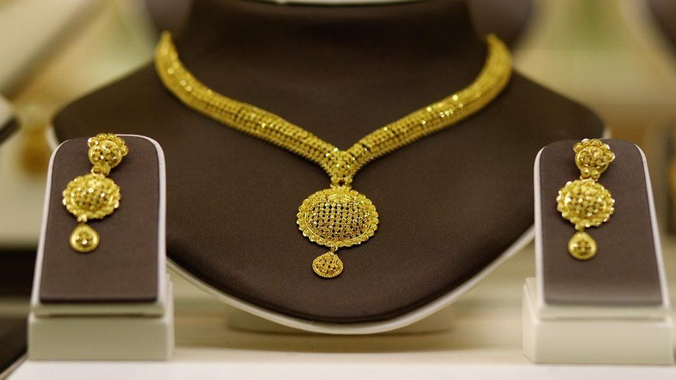A gold necklace and earrings set