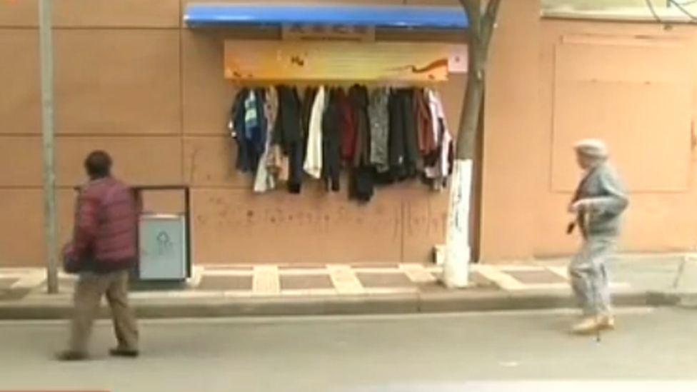 Clothes hung on a so-called wall of kindness
