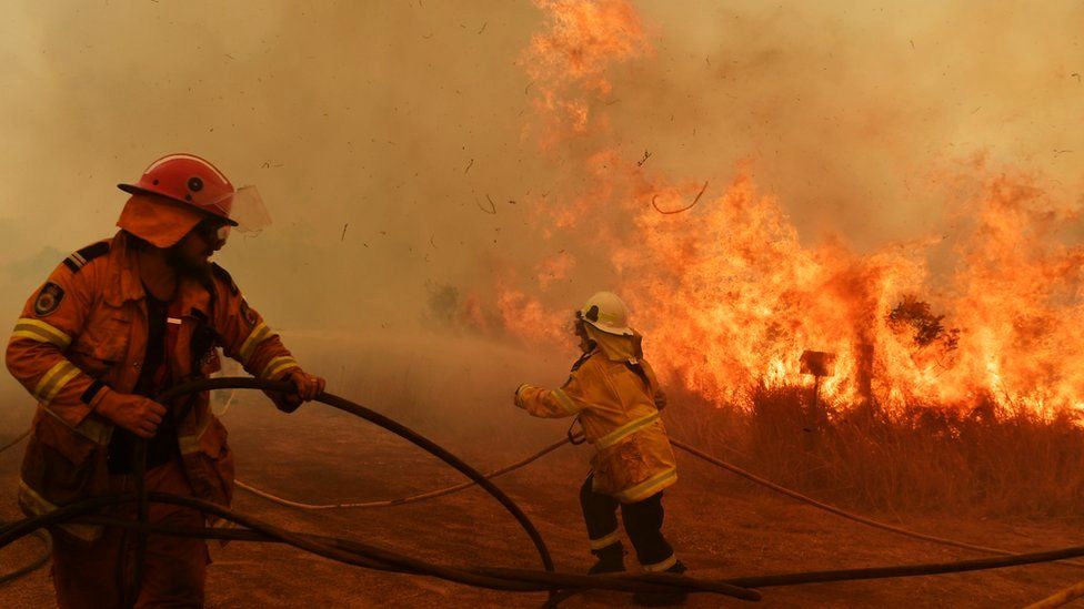 Australian firefighters battle a wildfire at close range earlier this month