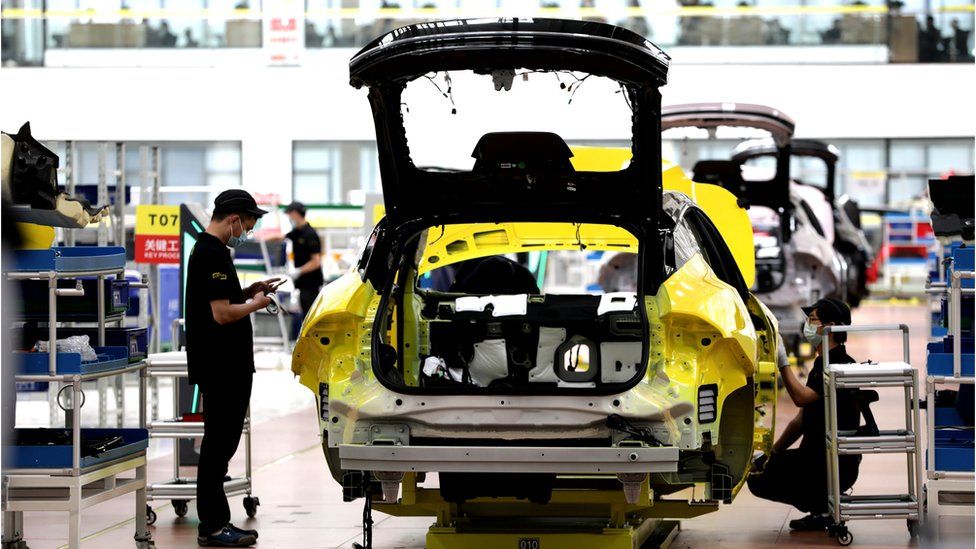 Workers assemble Lotus NYO Eletre electric SUVs at the smart plant of Wuhan Lotus Technology in Wuhan in central China's Hubei province Friday, July 15, 2022.